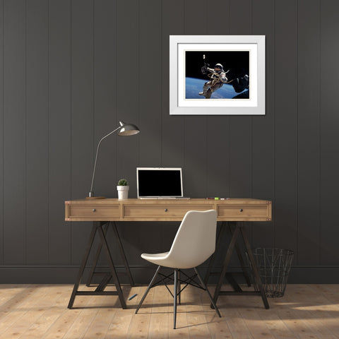 Astronaut Edward White during first EVA performed during Gemini 4 flight White Modern Wood Framed Art Print with Double Matting by NASA