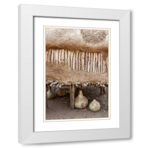 Namibia, Opuwo Gourds under food storage hut White Modern Wood Framed Art Print with Double Matting by Kaveney, Wendy