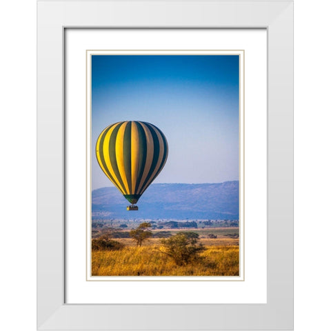 A hot-air balloon slowly traverses over the Serengeti plain White Modern Wood Framed Art Print with Double Matting by Richardson, Larry