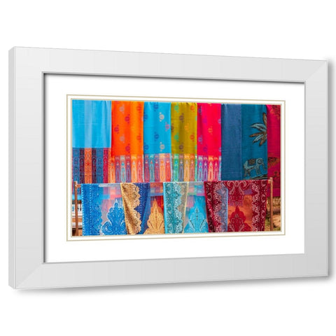 Laos- Luang Prabang. Colorful textiles- possibly scarves- for sale. White Modern Wood Framed Art Print with Double Matting by Haseltine, Tom