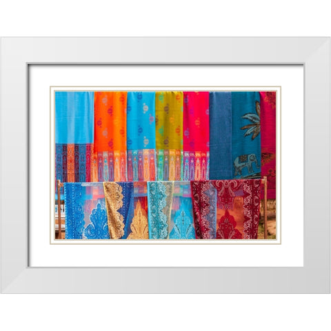 Laos- Luang Prabang. Colorful textiles- possibly scarves- for sale. White Modern Wood Framed Art Print with Double Matting by Haseltine, Tom