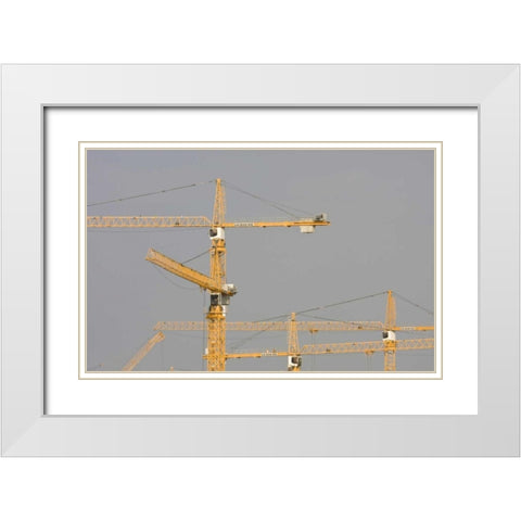UAE, Dubai, Marina Yellow construction cranes White Modern Wood Framed Art Print with Double Matting by Young, Bill