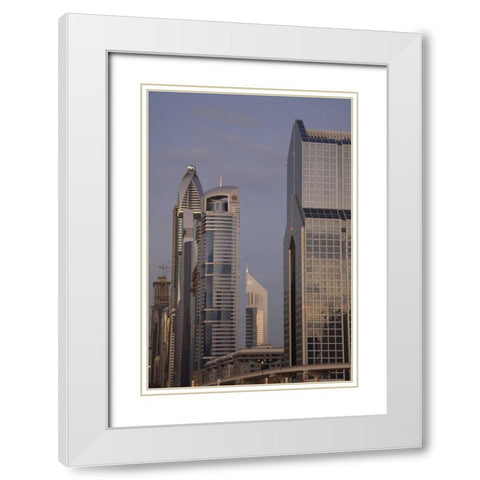 UAE, Dubai Towers along Sheik Zayed Road White Modern Wood Framed Art Print with Double Matting by Young, Bill