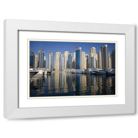 UAE, Dubai Marina towers with boats at anchor White Modern Wood Framed Art Print with Double Matting by Young, Bill