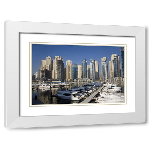 UAE, Dubai Marina towers with boats at anchor White Modern Wood Framed Art Print with Double Matting by Young, Bill