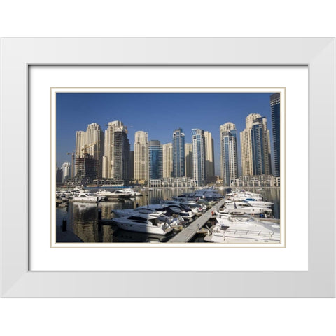 UAE, Dubai Marina towers with boats at anchor White Modern Wood Framed Art Print with Double Matting by Young, Bill