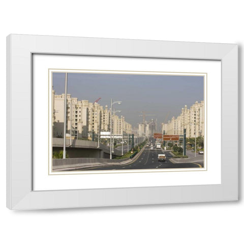 UAE, Dubai Road to the Palm Jumeirah complex White Modern Wood Framed Art Print with Double Matting by Young, Bill