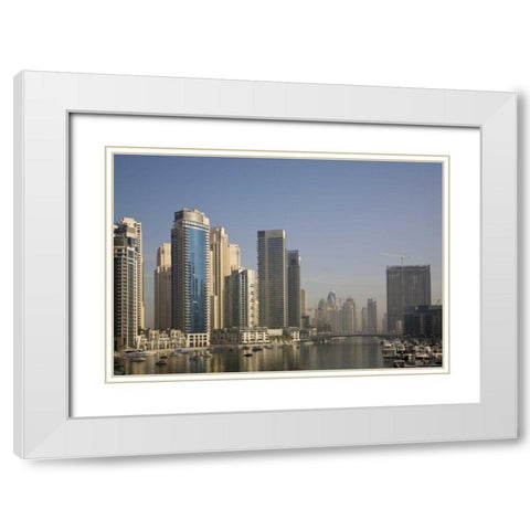 UAE, Dubai Marina towers with boats at anchor White Modern Wood Framed Art Print with Double Matting by Young, Bill