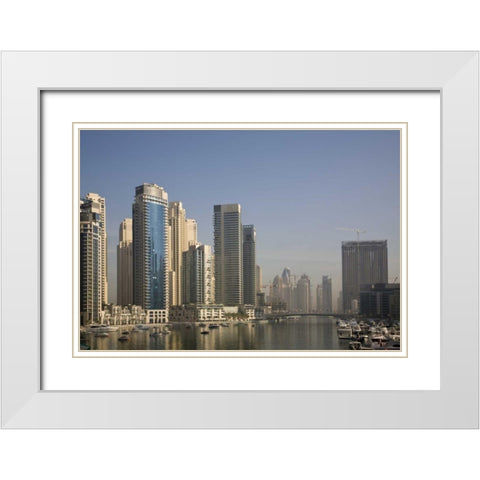 UAE, Dubai Marina towers with boats at anchor White Modern Wood Framed Art Print with Double Matting by Young, Bill