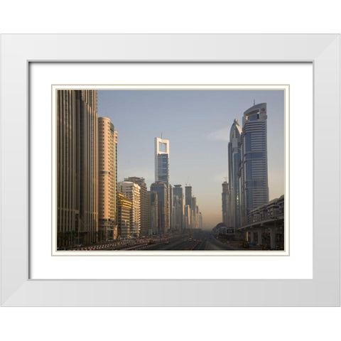 UAE, Dubai Towers along Sheik Zayed Road White Modern Wood Framed Art Print with Double Matting by Young, Bill