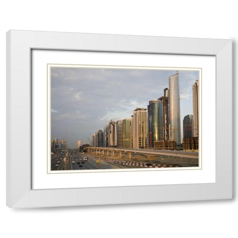 UAE, Dubai Jumeirah Lake Towers beside a Road White Modern Wood Framed Art Print with Double Matting by Young, Bill