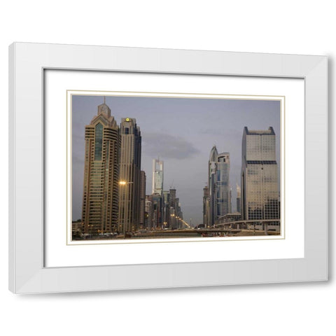 UAE, Dubai Towers along Sheik Zayed Road White Modern Wood Framed Art Print with Double Matting by Young, Bill