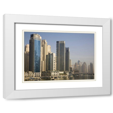 UAE, Dubai Marina towers with boats at anchor White Modern Wood Framed Art Print with Double Matting by Young, Bill