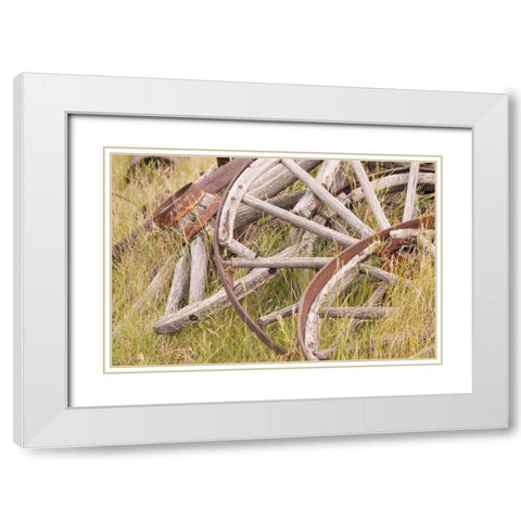 Canada, BC, Fort Steele Wagon wheels in grass White Modern Wood Framed Art Print with Double Matting by Paulson, Don