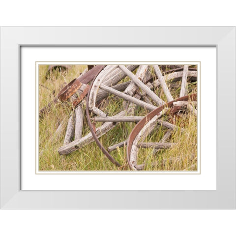 Canada, BC, Fort Steele Wagon wheels in grass White Modern Wood Framed Art Print with Double Matting by Paulson, Don
