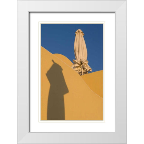 Greece, Santorini Sun umbrella against a wall White Modern Wood Framed Art Print with Double Matting by Young, Bill