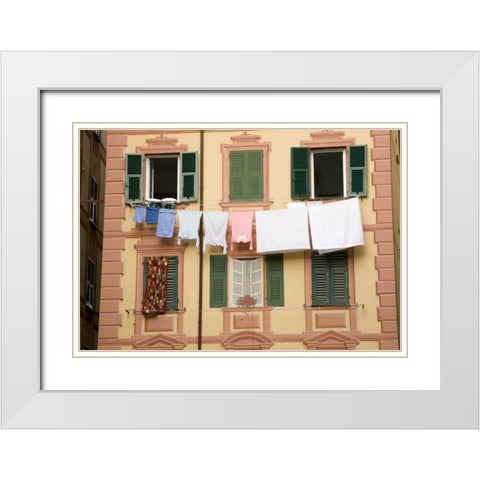 Italy, Camogli Laundry hangs across a building White Modern Wood Framed Art Print with Double Matting by Kaveney, Wendy