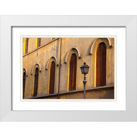 Italy-Tuscany-Lucca Street lamppost and arched windows with wooden shutters White Modern Wood Framed Art Print with Double Matting by Eggers, Julie