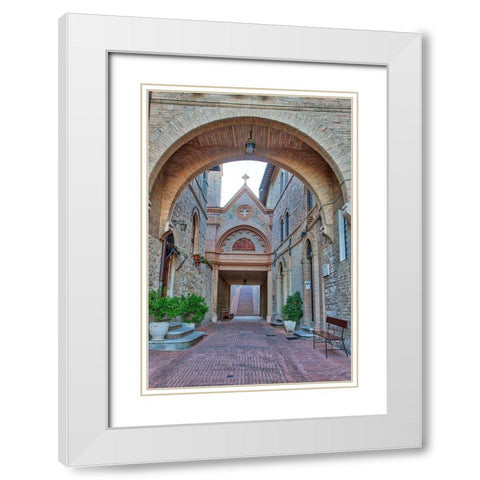 Italy- Umbria- Assisi. Archway and path leading to the Monastero della Santa Croce Catholic Church. White Modern Wood Framed Art Print with Double Matting by Eggers, Julie