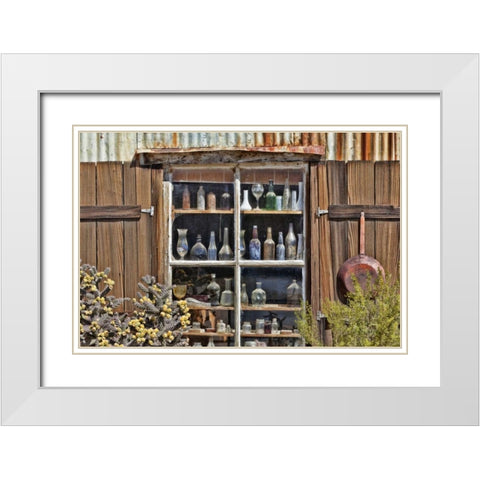 CA, Randsburg Bottles in window of a store White Modern Wood Framed Art Print with Double Matting by Paulson, Don