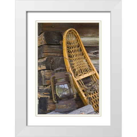 MT, A lantern and snowshoe outside a log cabin White Modern Wood Framed Art Print with Double Matting by Paulson, Don
