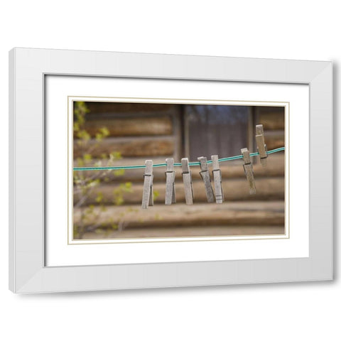 MT, Clothes pins on a clothesline by a log cabin White Modern Wood Framed Art Print with Double Matting by Paulson, Don