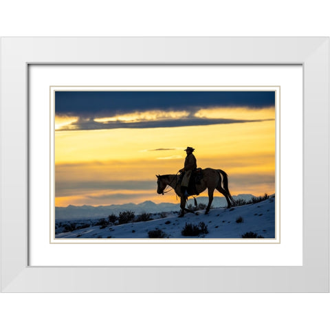 USA- Shell- Wyoming. Hideout Ranch cowgirl silhouetted on horseback at sunset.  White Modern Wood Framed Art Print with Double Matting by Gulin, Darrell