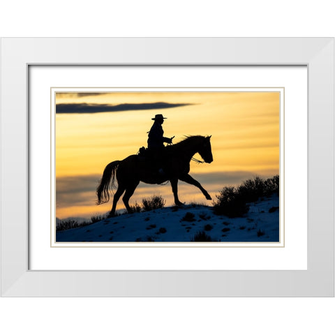 USA- Shell- Wyoming. Hideout Ranch cowgirl silhouetted on horseback at sunset.  White Modern Wood Framed Art Print with Double Matting by Gulin, Darrell