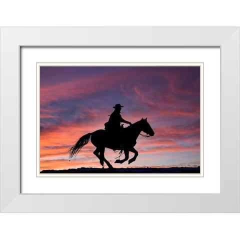 USA- Shell- Wyoming. Hideout Ranch cowgirl silhouetted on horseback at sunset.  White Modern Wood Framed Art Print with Double Matting by Gulin, Darrell