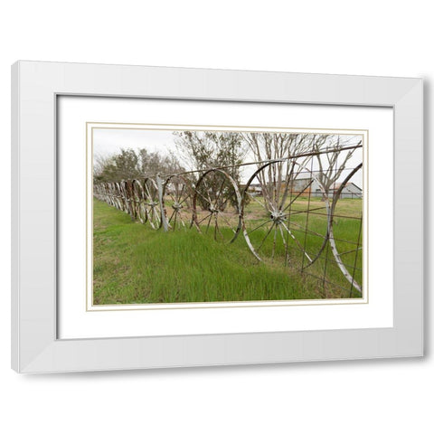A fence made of wagon wheels near Schulenburg in Fayette County, TX White Modern Wood Framed Art Print with Double Matting by Highmith, Carol