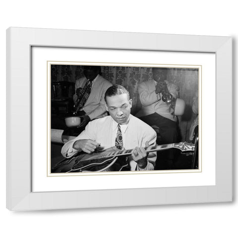 Fred Guy playing guitar at the Aquarium-New York 1946 White Modern Wood Framed Art Print with Double Matting by Gottlieb, William