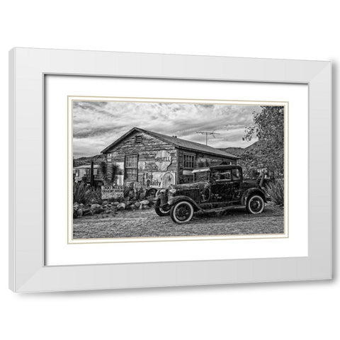 Vintage Car in Front of Old Gas Station White Modern Wood Framed Art Print with Double Matting by Vintage Photo Archive