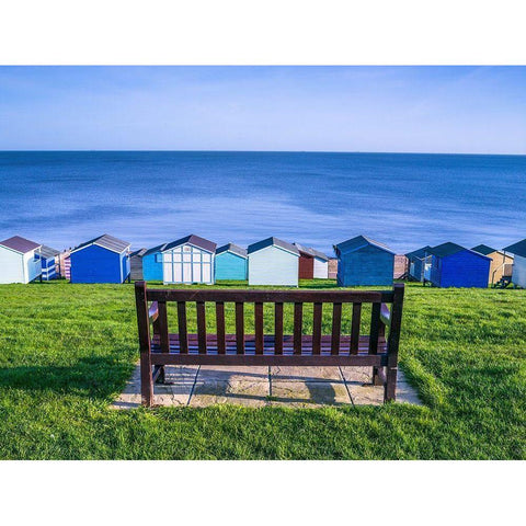 Bench on lawn with beach huts in background Black Modern Wood Framed Art Print by Frank, Assaf