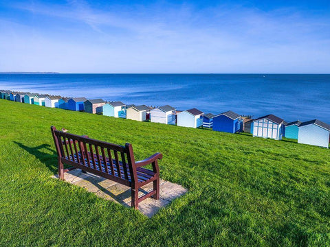 Bench on lawn with beach huts in background White Modern Wood Framed Art Print with Double Matting by Frank, Assaf