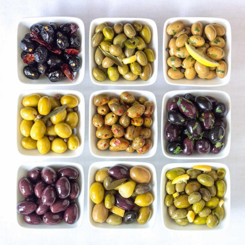 Varieties of Olives in bowls on white background Gold Ornate Wood Framed Art Print with Double Matting by Frank, Assaf