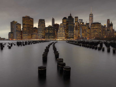 Manhattan skyline with rows of groynes in East river, New York Black Ornate Wood Framed Art Print with Double Matting by Frank, Assaf