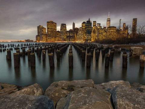 Manhattan skyline with rows of groynes in East river, New York Black Ornate Wood Framed Art Print with Double Matting by Frank, Assaf