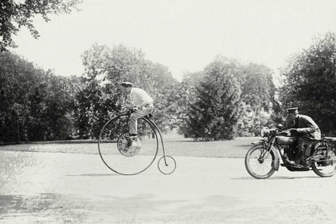 Motorcycle cop chases a Penny Farthing Velocipede White Modern Wood Framed Art Print with Double Matting by Unknown