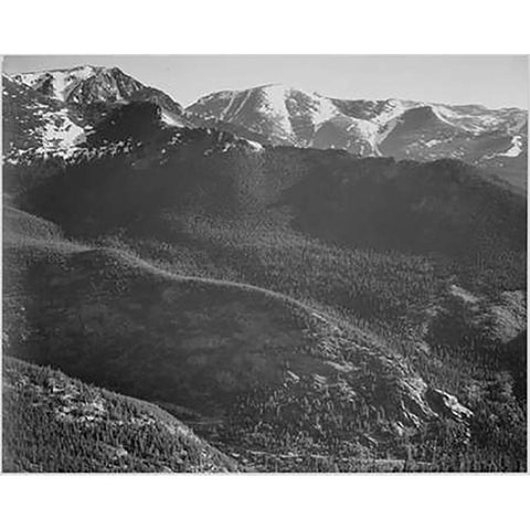 View of wooded hills with mountains in background, in Rocky Mountain National Park, Colorado, ca. 19 White Modern Wood Framed Art Print by Adams, Ansel