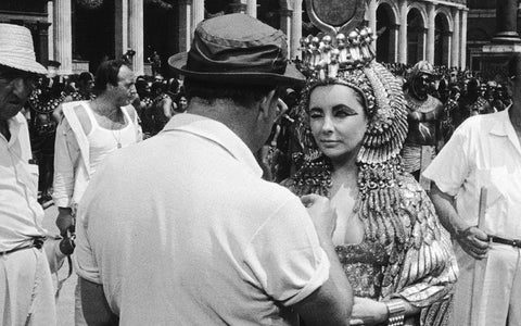 Behind the Scenes - Elizabeth Taylor - Cleopatra Black Ornate Wood Framed Art Print with Double Matting by Hollywood Photo Archive