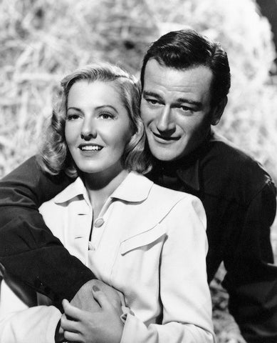 John Wayne with Jean Arthur White Modern Wood Framed Art Print with Double Matting by Hollywood Photo Archive