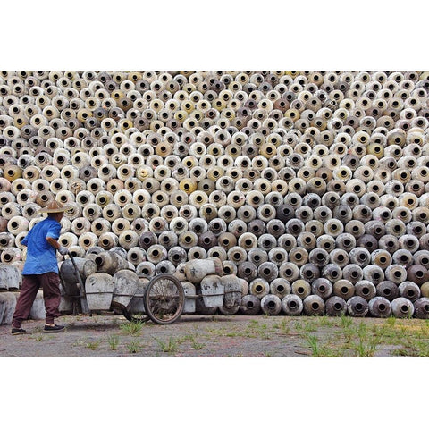 Man pushing cart loaded with wine jars to the big pile in a winery-Zhejiang Province-China Black Modern Wood Framed Art Print by Su, Keren