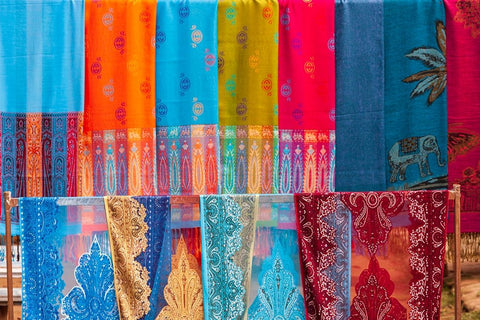 Laos- Luang Prabang. Colorful textiles- possibly scarves- for sale. Black Ornate Wood Framed Art Print with Double Matting by Haseltine, Tom