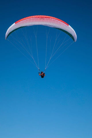 Austria-Dachstein-Paraglider soaring above Lake Hallstatt and the surrounding mountains White Modern Wood Framed Art Print with Double Matting by Looney, Hollice