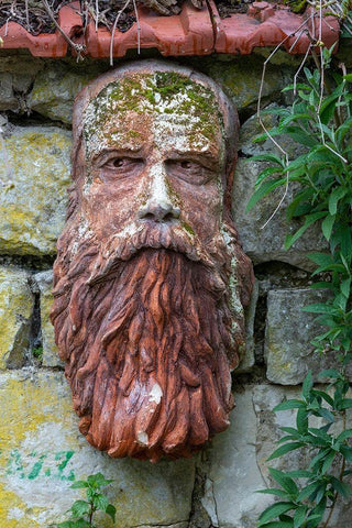 France-Giverny Stone face hanging on a stone wall  White Modern Wood Framed Art Print with Double Matting by Jaynes Gallery