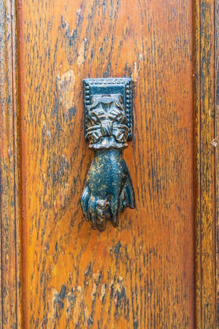France-Dordogne-Hautefort A metal door knocker in the shape of a hand in the town of Hautefort Black Ornate Wood Framed Art Print with Double Matting by Wilson, Emily