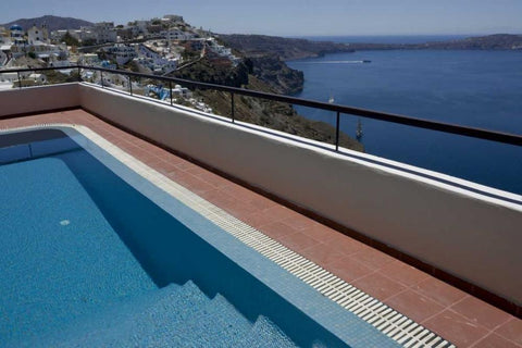 Greece, Santorini Swimming pool overlooking town Black Ornate Wood Framed Art Print with Double Matting by Young, Bill