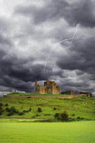 Ireland, Tipperary Lightning over Rock of Cashel Black Ornate Wood Framed Art Print with Double Matting by Flaherty, Dennis