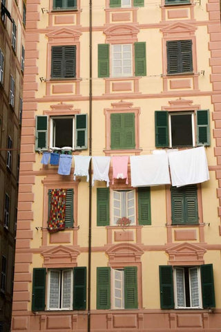 Italy, Camogli Laundry hangs across a building Black Ornate Wood Framed Art Print with Double Matting by Kaveney, Wendy
