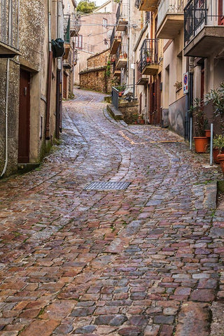 Palermo Province-Geraci Siculo Winding narrow cobblestone street in the town of Geraci Siculo White Modern Wood Framed Art Print with Double Matting by Wilson, Emily